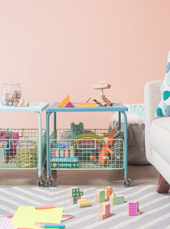 ikea toy storage hack, tv tray with shelf underneath in a living room with kids toys in it, ikea hacks for toddlers